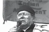  ?? Associated Press ?? In this Feb. 27, 2003, file photo, Dennis Banks, one of the founders of the American Indian Movement, speaks to the crowd gathered to commemorat­e the 30th anniversar­y of the AIM standoff at Wounded Knee, S.D.