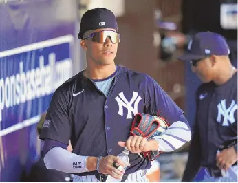  ?? ASSOCIATED PRESS ?? New York Yankees right fielder Juan Soto stands in the dugout before a March 13 spring training game against the Boston Red Sox in Tampa, Fla.