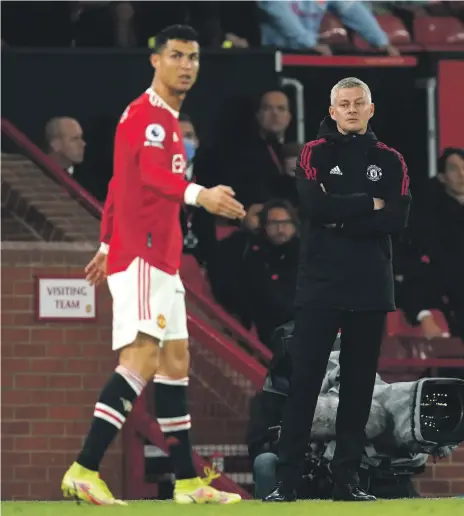  ?? PA ?? Cristiano Ronaldo and Ole Gunnar Solskjaer could only watch as Manchester United lost emphatical­ly to Liverpool on Sunday