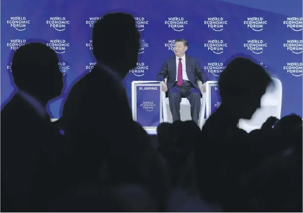  ?? FABRICE COFFRINI / AFP / GETTY IMAGES ?? In a speech in Davos on Tuesday, Xi Jinping made veiled allusions to Donald Trump and his controvers­ial statements on trade.