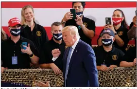  ?? (AP/Matt York) ?? President Donald Trump acknowledg­es supporters at the Yuma, Ariz., Internatio­nal Airport after his speech Tuesday.