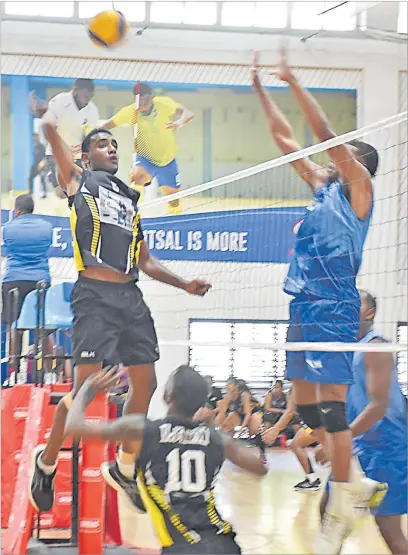  ?? Picture: SOPHIE RALULU ?? Lami player Ratu Loco Qiolevu (left) prepares to spike the ball against Suva during the HBK Vulaca Championsh­ip volleyball competitio­n at the FMF Gymnasium in Laucala Bay, Suva yesterday.