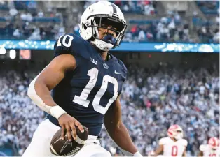  ?? BARRY REEGER/AP ?? Penn State freshman running back Nick Singleton, who rushed for 1,061 yards, ran for 12 touchdowns, a school record by a freshman, and had one receiving TD and one kickoff return for a TD.