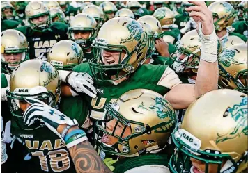  ?? [ASSOCIATED PRESS FILE PHOTO] ?? UAB players huddle up before a recent game.