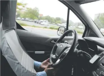  ?? Michael Laris, The Washington Post ?? Ford’s push for driverless vehicles includes a man pretending to be a car seat.