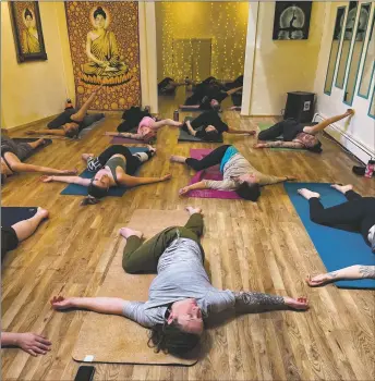  ?? COURTESY IN TUNE YOGA ?? A group gathers for a yoga birthday party at In Tune Yoga in Taos.