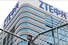  ?? NG HAN GUAN/THE ASSOCIATED PRESS ?? The U.S. ban on Chinese telecommun­ications firm ZTE for breaching terms of a settlement over sanction-breaking sales to Iran and North Korea has become entwined in a U.S.-China trade dispute. Donald Trump says too many Chinese jobs have been lost.