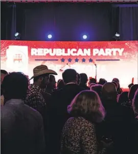  ?? Jon Cherry Bloomberg ?? PEOPLE GATHER at an Arizona Republican Party election night rally in Scottsdale. Key races for U.S. Senate and governor remained too close to call.