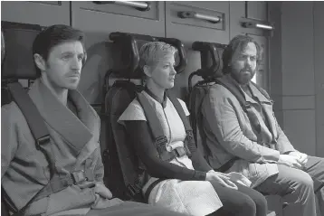  ?? Tribune News Service ?? ■ From left, Eoin Macken as Karl D’Branin, Gretchen Mol as Agatha and Angus Sampson as Rowan in Syfy’s “Nightflyer­s.”