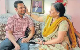  ?? DEEPAK GUPTA/ HT PHOTO ?? Anmol’s mother blessing him after his success in ISC.