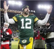  ?? MATT LUDTKE — THE ASSOCIATED PRESS ?? Green Bay Packers’ Aaron Rodgers celebrates after Saturday’s win over the Cleveland Browns during which he surpassed Brett Favre’s team record for touchdown passes.