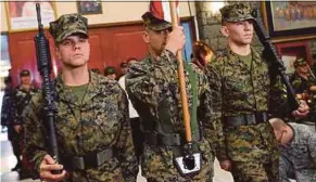  ?? AFP PIC ?? A US Marine colour guard marching during the opening of the annual Philippine­s-US military exercise at Camp Aguinaldo, Quezon City, suburban Manila yesterday.