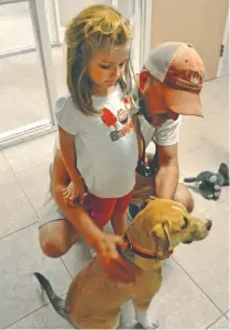  ?? STAFF PHOTO BY KIM SEBRING ?? Maggie and Blake Clemons wait to adopt Gracie Lou recently at the McKamey Center.