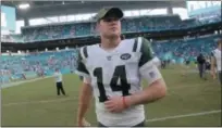  ?? LYNNE SLADKY - THE ASSOCIATED PRESS ?? In this Sunday, Nov. 4, 2018, file photo, New York Jets quarterbac­k Sam Darnold (14) walks off the field after an NFL football game against the Miami Dolphins, in Miami Gardens, Fla. The Jets have six games left and will be hard-pressed to even match the 5-11records they put up in each of the last two seasons. New York has two games against New England, including a home matchup out of the break, and meetings with Tennessee, Buffalo, Houston and Green Bay - no gimmes in the bunch. Darnold is still considered the future of the franchise, no matter how much he struggles this season.