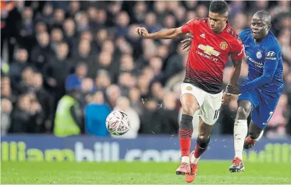  ?? MATT DUNHAM THE ASSOCIATED PRESS ?? Manchester United’s Marcus Rashford, left, tries to elude Chelsea’s N’Golo Kanté on Monday. Manchester United won 2-0.