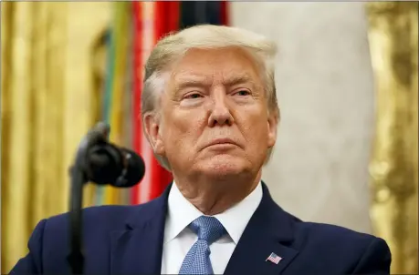  ?? ALEX BRANDON — THE ASSOCIATED PRESS ?? President Donald Trump pauses before speaking during a ceremony to present the Presidenti­al Medal of Freedom to former Attorney General Edwin Meese, in the Oval Office of the White House Tuesday in Washington.