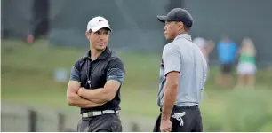  ?? AP file ?? Tiger Woods with his swing coach Chris Como during a practice round. —