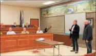  ?? CHARLES PRITCHARD - ONEIDA DAILY DISPATCH ?? Dr. John Costello Jr., left, and Paul Marco of the Oneida City Center Committee give councilors an overview of their project on Feb. 6, 2018