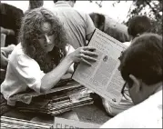  ?? CONTRIBUTE­D BY LARRY MURPHY ?? Records at KMFA’s Musical Garage Sale sold for a mere $1.50 each when this was taken, probably in the 1980s.