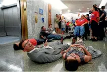  ?? PHOTO: REUTERS ?? Demonstrat­ors lie on the floor as the Senate Finance Committee holds a hearing on the latest Republican effort to repeal and replace the Affordable Care Act, on Capitol Hill in Washington, DC.