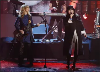  ?? DANNY MOLOSHOK — INVISION/AP ?? Nancy Wilson, left, and Ann Wilson of the band Heart perform as Heart is inducted into the Rock & Roll Hall of Fame in 2013in Los Angeles.