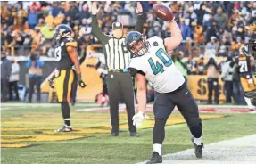  ?? GEOFF BURKE/USA TODAY SPORTS ?? Jaguars fullback Tommy Bohanon celebrates after catching a TD pass in the AFC playoffs.