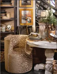  ?? (Handout via TNS) ?? A dining chair charms in sumptuous animal print.