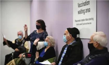  ??  ?? People wait to receive their Covid vaccine in Stevenage, Hertfordsh­ire. Photograph: Joe Giddens/EPA