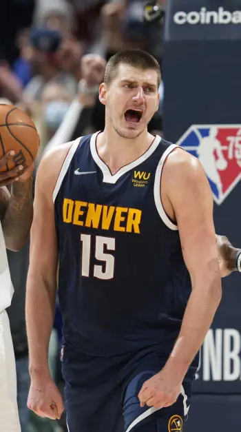  ?? David Zalubowski, The Associated Press ?? Jokic screams after scoring a basket in overtime against the Los Angeles Clippers on Jan. 19 at Ball Arena. The Nuggets won 130-128.