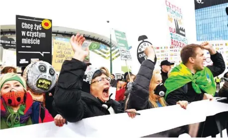  ?? AFP ?? Protesters shout slogans during a march for the climate on the sidelines of a UN summit on Saturday in Katowice, Poland.