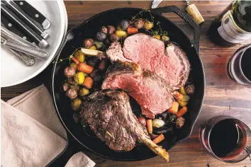  ?? Cheyenne Cohen / Associated Press ?? A prime rib is cooked to a perfect medium rare after the cook followed tested techniques — including letting it rest for 30 miutes. Highend cuts of meat won’t taste expensive without care in the kitchen.