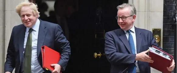  ?? CHRIS J RATCLIFFE/GETTY IMAGES FILE PHOTO ?? Boris Johnson, left, and to a lesser extent Michael Gove, right, were the two key Conservati­ve politician­s (and former allies of British Prime Minister David Cameron) who gave the campaign to leave the EU a huge boost, when they announced their support...