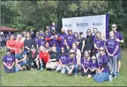  ?? PHOTO PROVIDED ?? Walkers pose with representa­tives from sponsor Fingerpain­t at last year’s Walk to End Epilepsy.