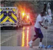  ?? Elizabeth Conley / Houston Chronicle ?? A patient returns from a smoke break as ambulances line up to evacuate some of the ICU patients out of Ben Taub Hospital as Tropical Storm Harvey inches its way through the area Monday.