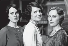  ?? NICK BRIGGS/CARNIVAL FILM AND TELEVISION ?? Michelle Dockery, from left, Elizabeth McGovern and Laura Carmichael on “Downton Abbey,” which chronicled the lives of a British aristocrat­ic family and their servants.