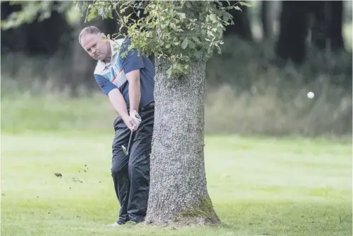  ??  ?? 0 Alistair Forsyth plays out from behind a tree at the 11th hole at Downfield, the venue for this year’s Scottish PGA Championsh­ip.