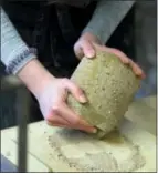  ??  ?? A British schoolchil­d works a piece of clay at the Coming World Remember Me workshop in Ypres, Belgium on Monday.