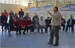  ??  ?? Ahmad Waadallah, a professor of psychology, leads a training to school teachers on how best to handle students suffering from trauma at a university in the battered city of Mosul.