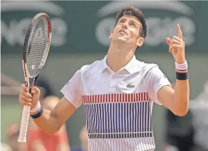  ?? SUSAN MULLANE, USA TODAY SPORTS ?? Defending champion Novak Djokovic beat Marcel Granollers in straight sets Monday in the French Open 6-3, 6-4, 6-2 in Paris.