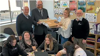  ??  ?? The handing over of laptops to the YMCA. From back left, Paul Johnston (Freemason Timaru), Jeff Elston (Freemason South Island manager), Linda Callaghan (YMCA tutor), Robin Fuller (Freemason Timaru); front from left, YMCA students Trystana Howard, Sammie Ritchie, Olivia Allen, Morgan Sweetman.