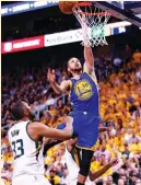  ?? (TNS) ?? GOLDEN STATE WARRIORS guard Steph Curry goes up to the hoops for two of his game-high 30 points in Monday night’s 121-95 Game 4 victory for the Warriors over the Utah Jazz in Salt Lake City to close out the first-round Western Conference series.