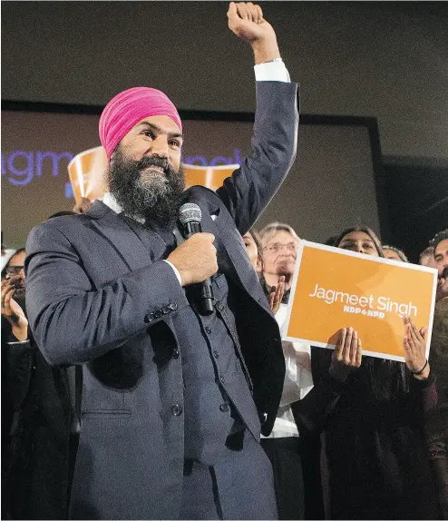  ?? CHRIS YOUNG / THE CANADIAN PRESS ?? Jagmeet Singh celebrates with supporters after he was elected leader of the federal New Democratic Party on the first ballot at the party’s convention in Toronto on Sunday, earning 53.8 per cent of the vote.