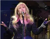  ?? Tribune News Service ?? ■ Stevie Nicks, vocalist for Fleetwood Mac, sings one of the group’s opening songs on Feb. 24 at Spectrum Center in Charlotte, N.C.