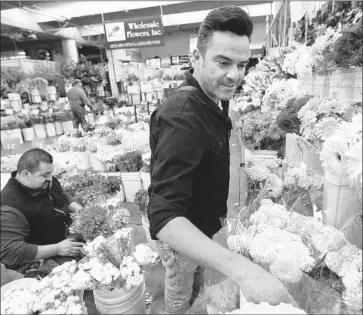  ?? Al Seib Los Angeles Times ?? THE U.S. produced $374 million in wholesale cut stems in the 15 states that produce most domestic flowers; 78% come from California, recent figures show. Above, Manuel Acosta at the flower market in L.A. in 2016.