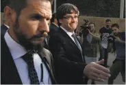  ?? Manu Fernandez / Associated Press ?? Catalan President Carles Puigdemont (right) seeks to negotiate with Madrid over independen­ce.