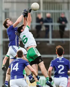  ?? OLIVER McVEIGH/SPORTSFILE ?? Burren No 6 Connor Toner in an aerial duel with Scotstown’s Frank Caulfield (left) during yesterday’s AIB Ulster club SFC clash at Newry