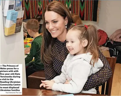  ?? Paul Edwards/The Sun ?? > The Princess of Wales poses for a picture with with five-year-old Zlata Yeromenko during a visit to the Reading Ukrainian Community Centre to meet displaced Ukrainian families