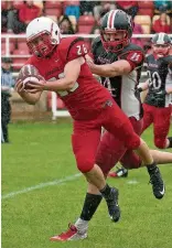  ??  ?? Pushing on Jamie McLaughlin carries the ball