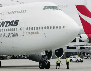  ?? GREG WOOD/AFP/GETTY IMAGES FILES ?? An expanded air agreement between Canada and Australia doubles the seat capacity on routes between the two countries to 6,000 per week.