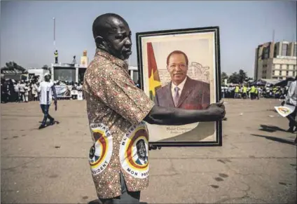  ?? Photos: Olympia de Maismont/afp & Guy Petersen/afp ?? Justice: Ousted Burkino Faso president Blaise Compaoré
(in portrait above) received a life sentence at the trial in Ougadougou (left) for Thomas Sankara’s assassinat­ion.